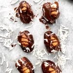 6 almond joy date truffles on a white background