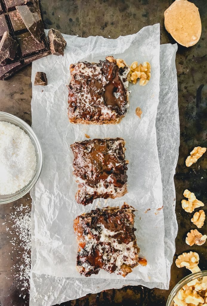 three healthy 7 layer bars on a cookie sheet