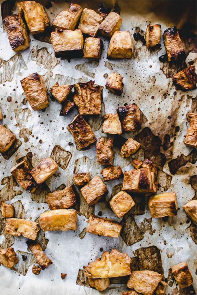 tray of broiled tofu on parchment