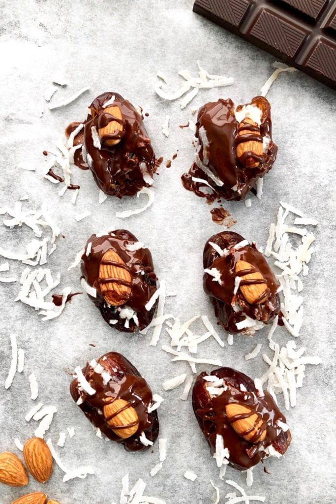 six chocolate dates filled with coocnut and almonds