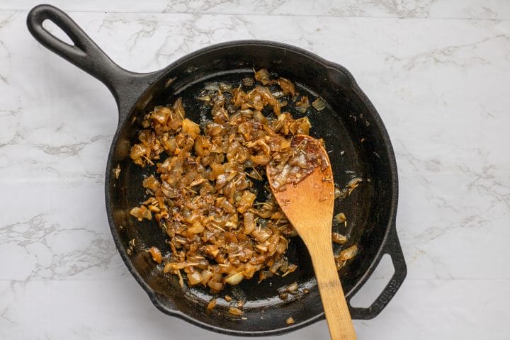 cast iron skillet with caramelized onions