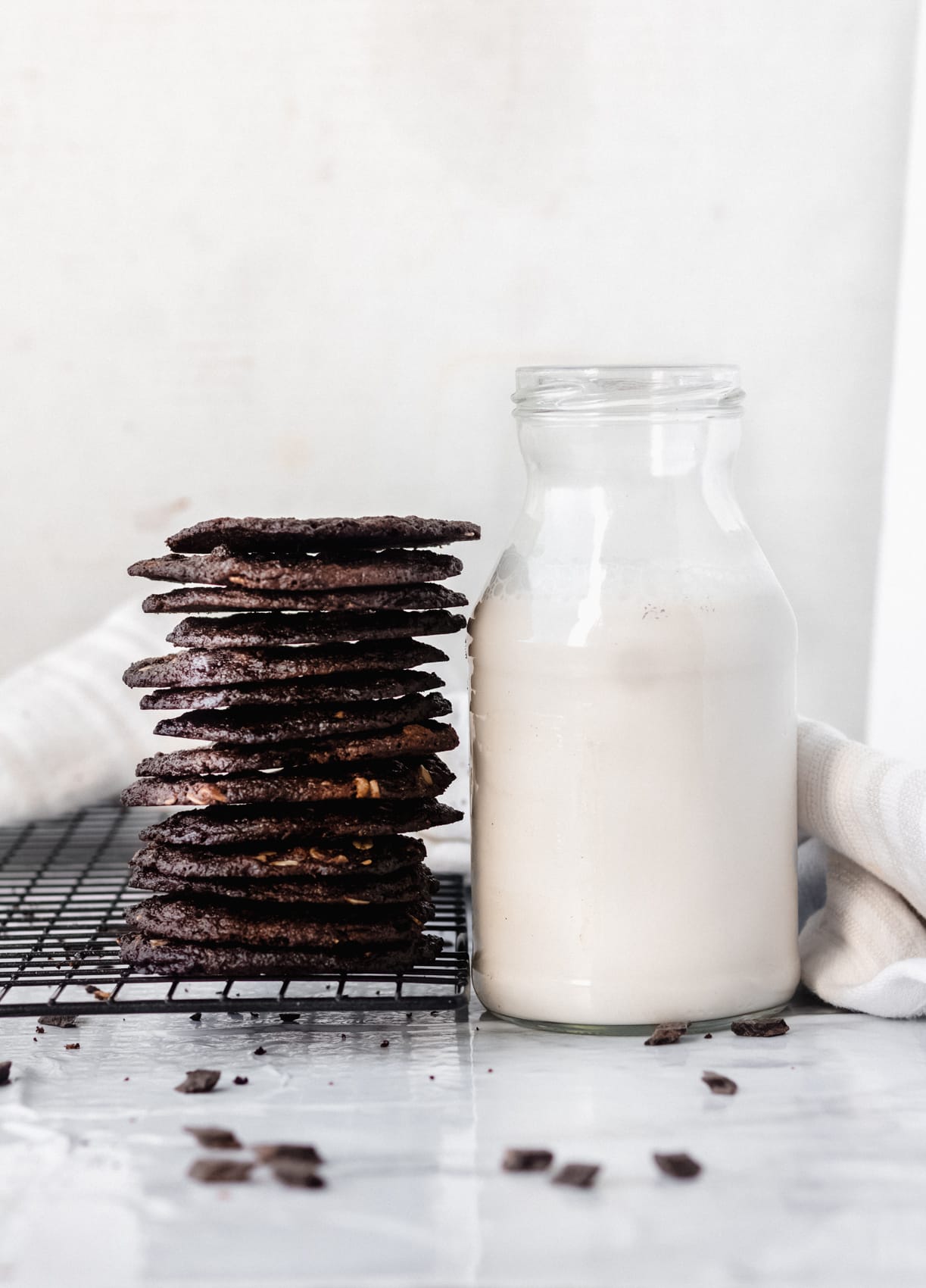 tates cookies with chocolate and a glass of almond milk
