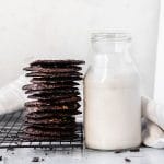 stack of chocolate chip cookies and a glass of milk
