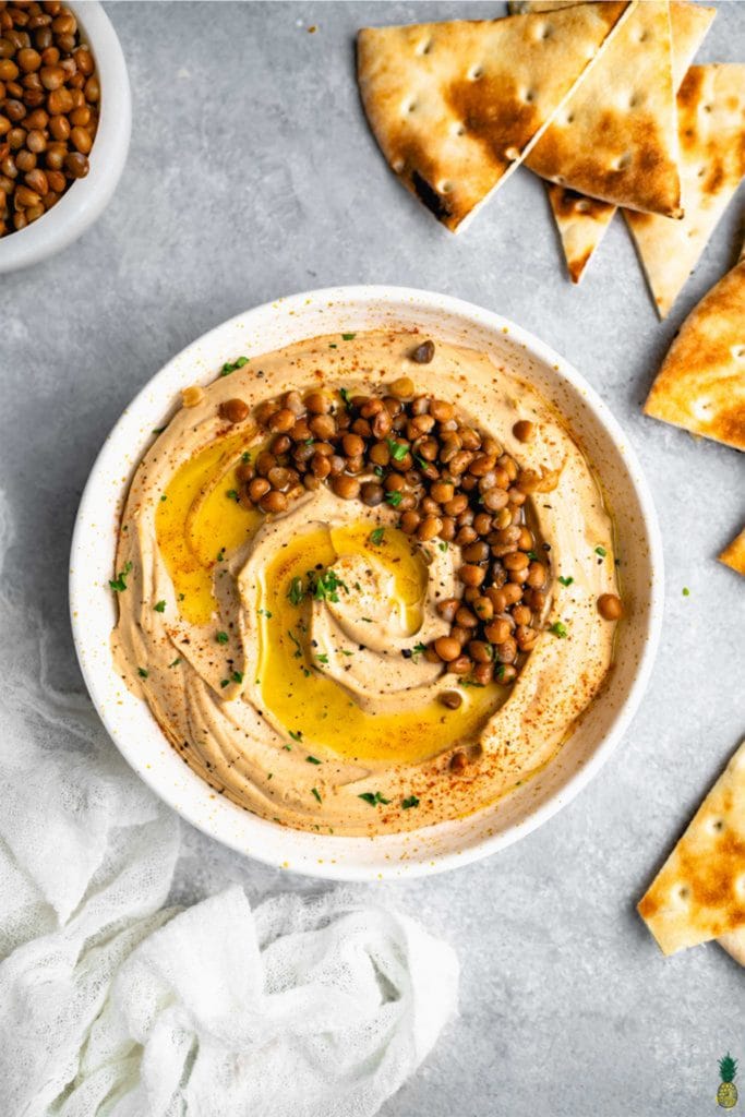 high protein vegan meal with hummus in a white bowl