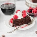 slice of vegan red wine chocolate cake with a silver fork