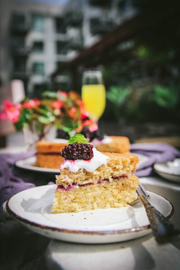 one slice of olive oil cake with blackberries