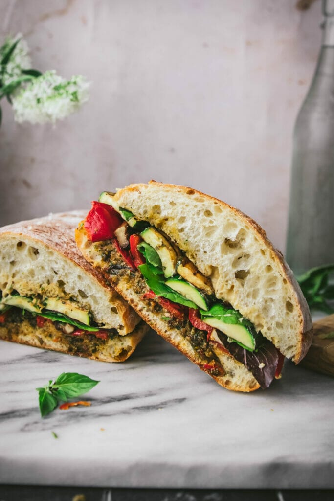 one grilled veggie party sub on ciabatta bread, sliced
