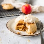 apple hand pie with a scoop of ice cream and a fork