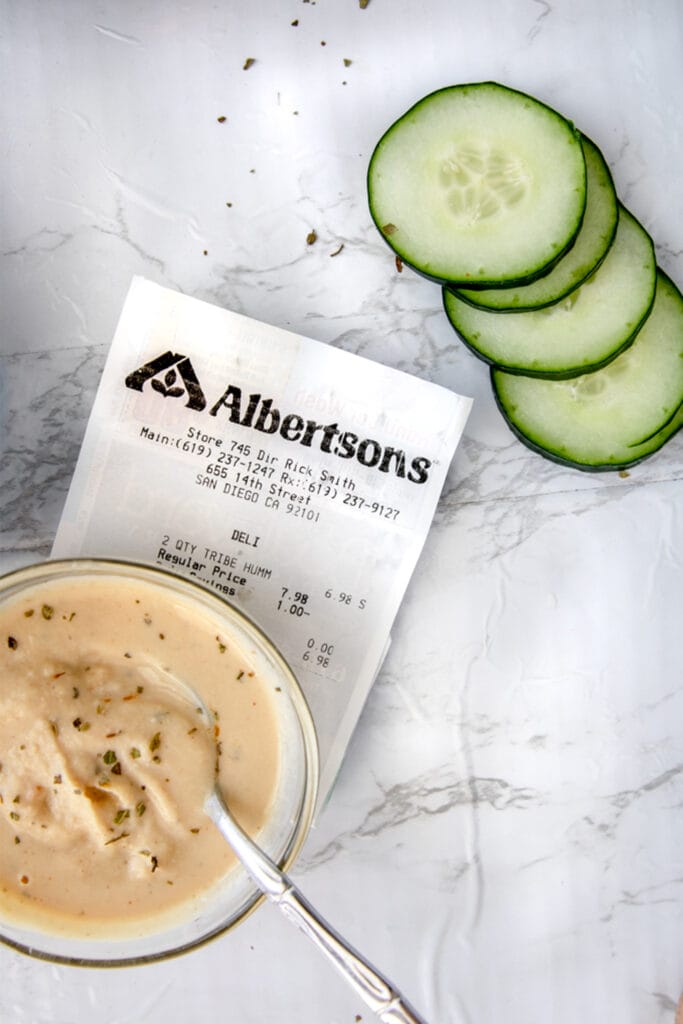 albertsons shopping receipt next to come cucumber sliced