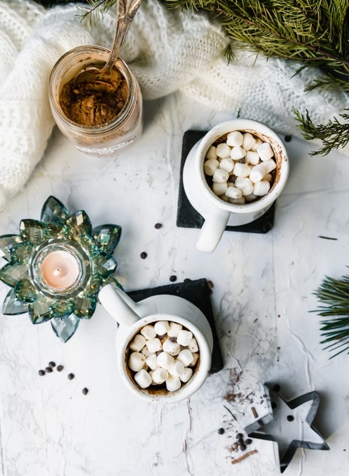 overhead shot of two mugs of dairy-free hot cocoa