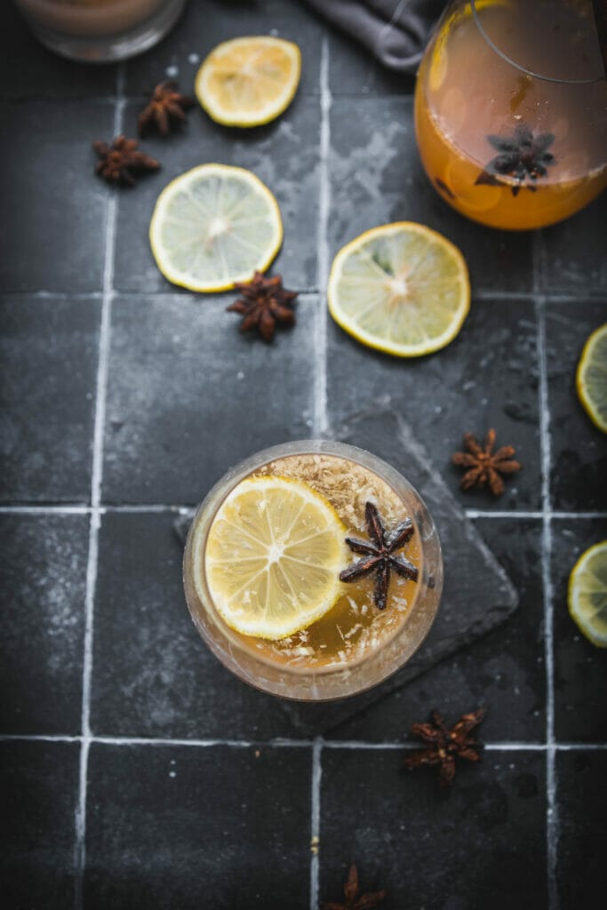 overhead shot of a classic hot toddy with a lemon circle and star anise