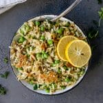close up of crispy orzo with garlic butter on grey table