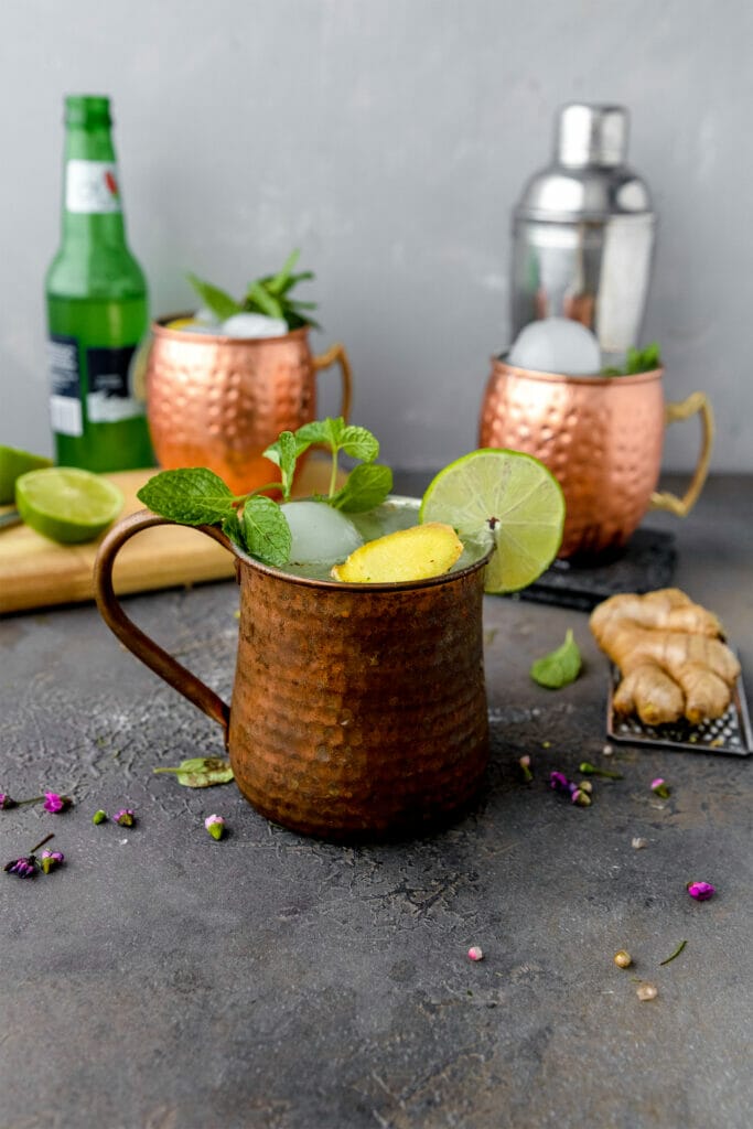 three extra gingery moscow mules garnished with mint and limes