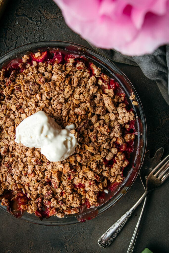 brown butter rhubarb crumble next to two forks