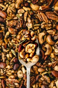 rosemary spiced nuts in a silver spoon
