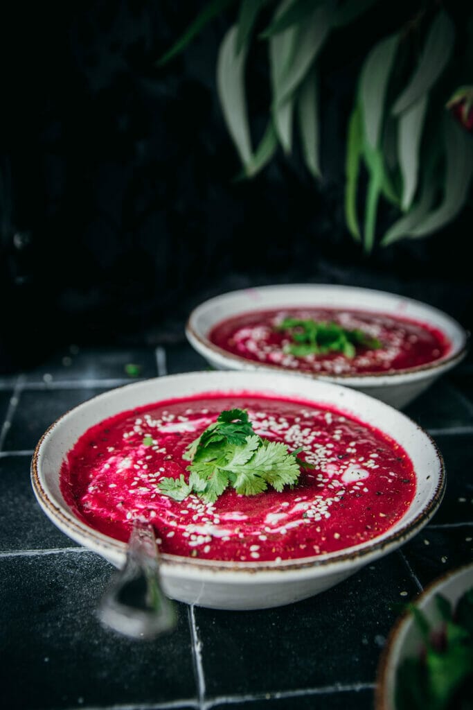 side view of a bowl of beet carrot ginger soup