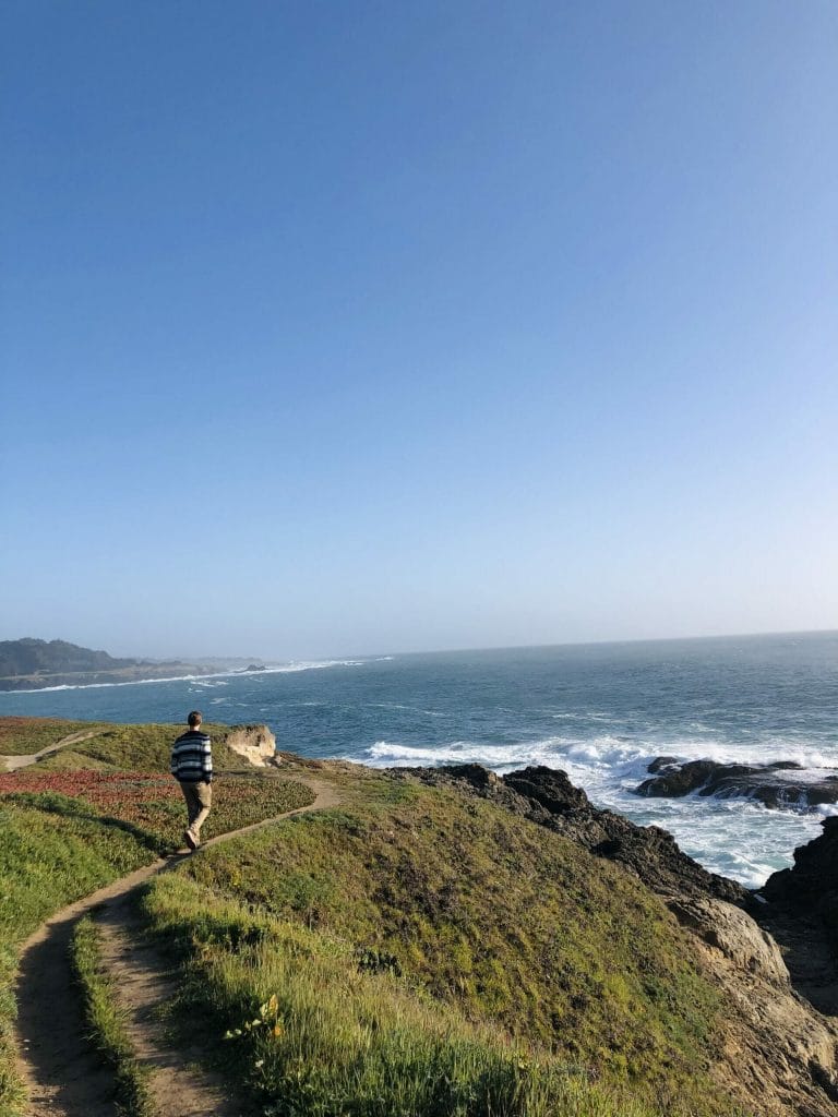 Dan Meyers walking on a path on the cliffs of Mendocino