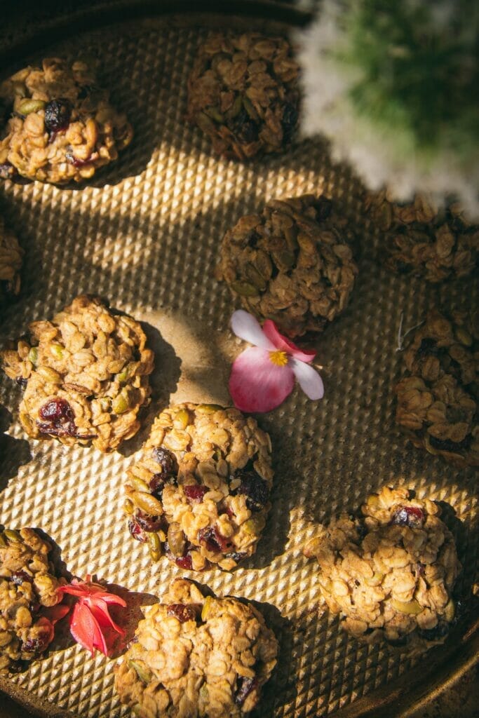 close up overhead shot of a tray of vegan granola breakfast cookies