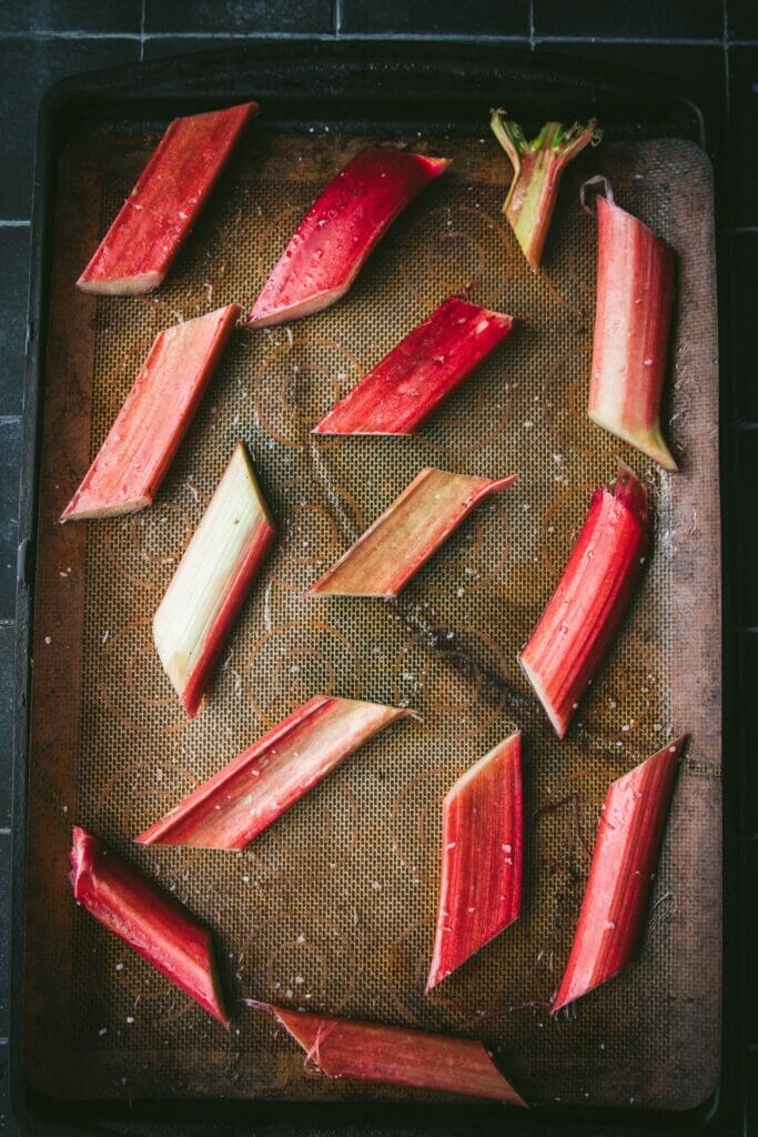 tray of sliced rhubarb on lined baking sheet