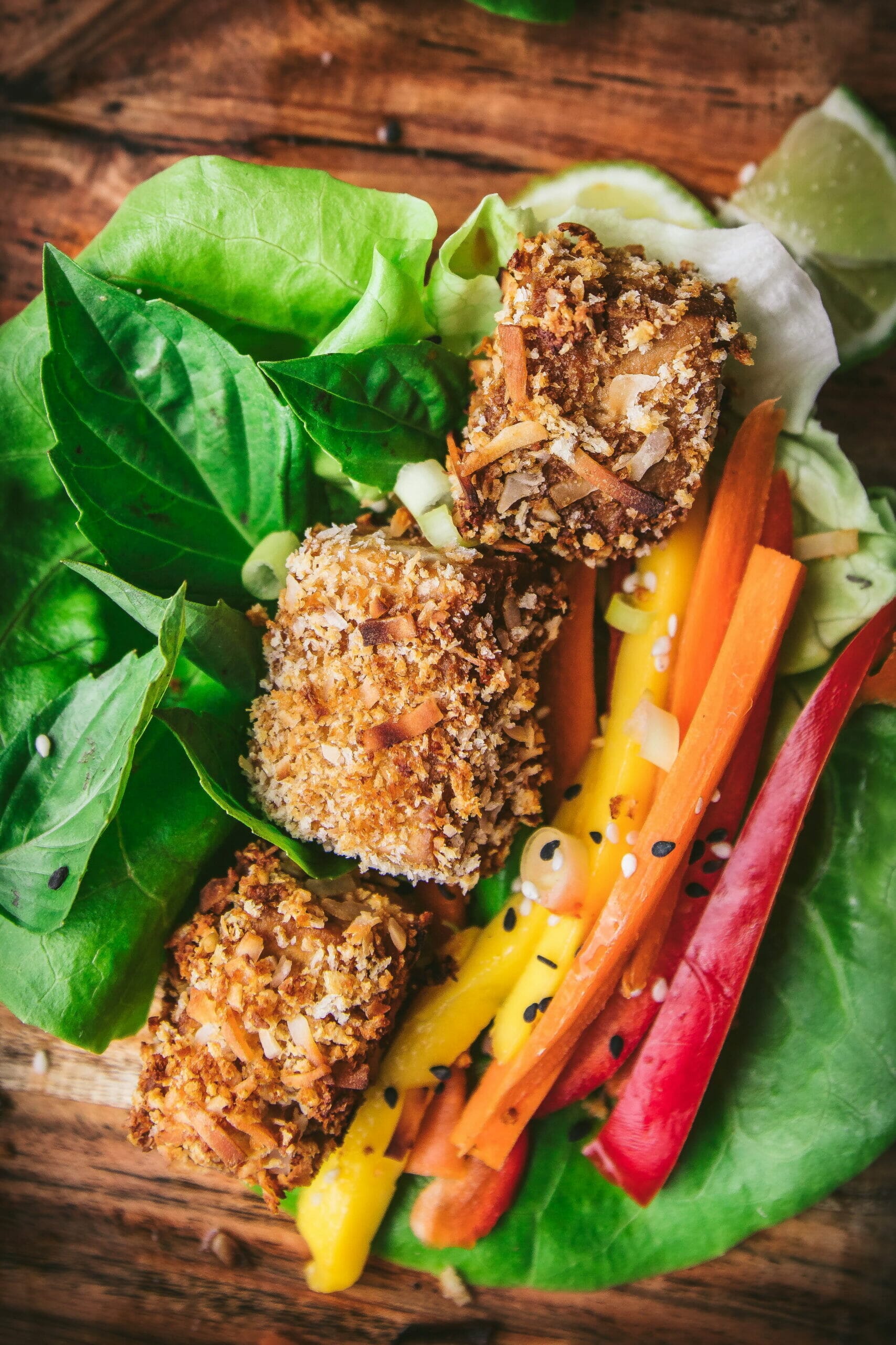 close up of coconut crusted tofu in a lettuce wrap