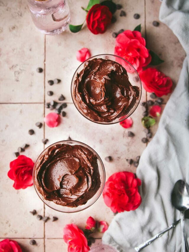 vegan chocolate pudding on a table with pink roses
