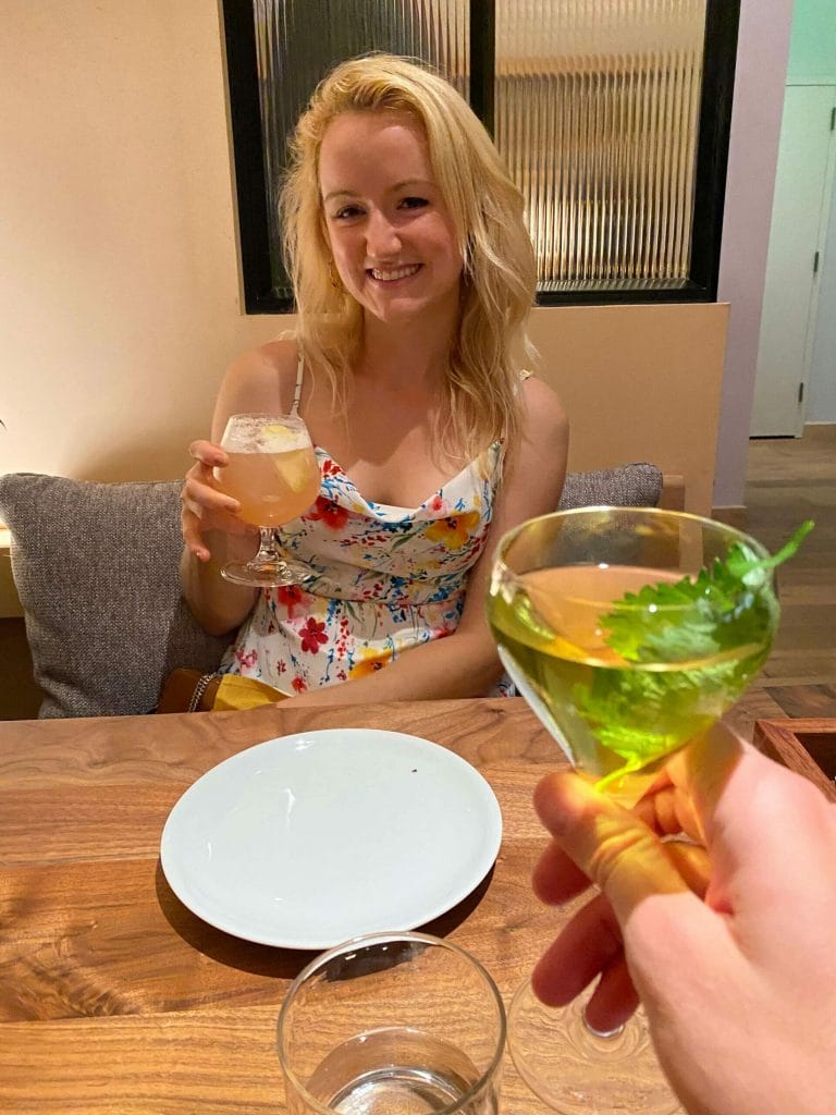 Emily Meyers holding a cocktail at Callie
