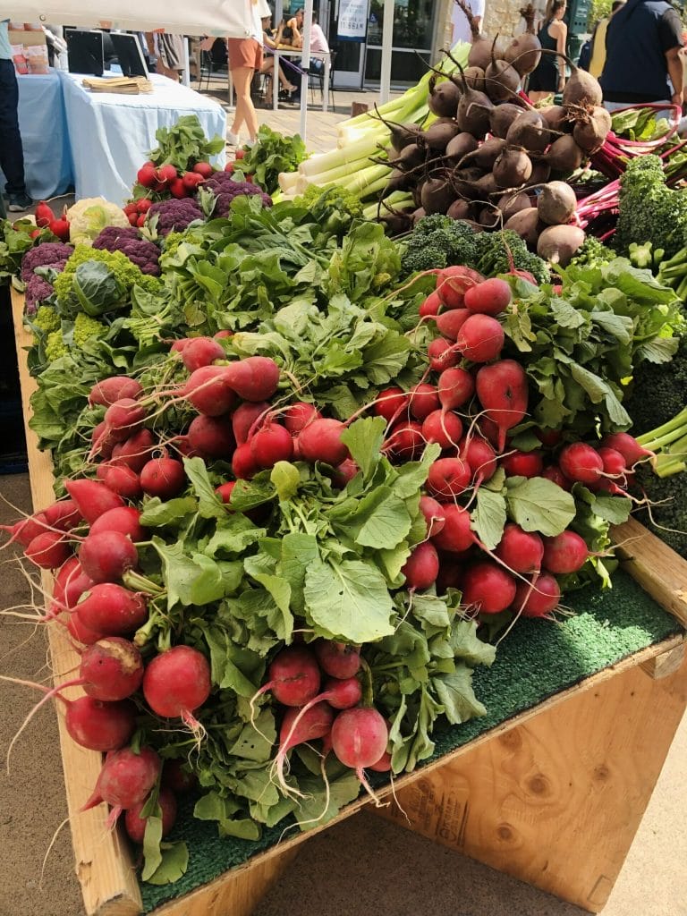 tray of radishes at the farmer's market