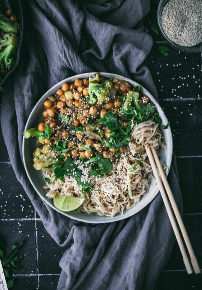 overhead view of a bowl of black pepper chickpeas with noodles