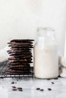tates cookies with chocolate and a glass of almond milk