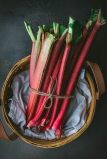 a basket of rhubarb stalks tied with twine
