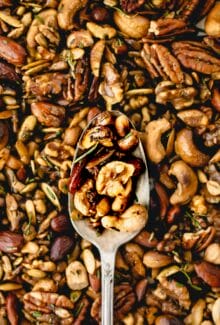 rosemary spiced nuts in a silver spoon